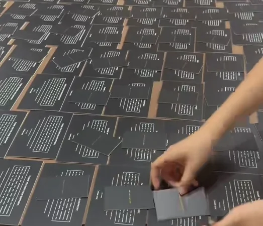 Workers assembling the second layer of product kit components