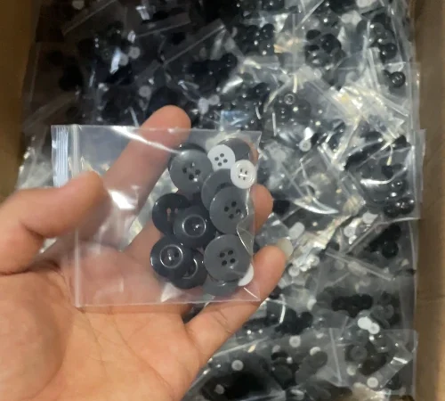 Buttons packed into individual OPP bags before final sewing kit assembly